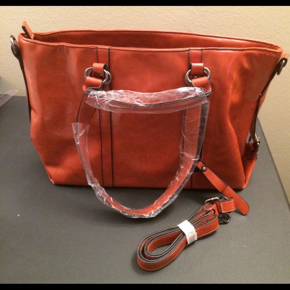 NWOT. Shoulder bag. Tan/orange-ish faux leather.